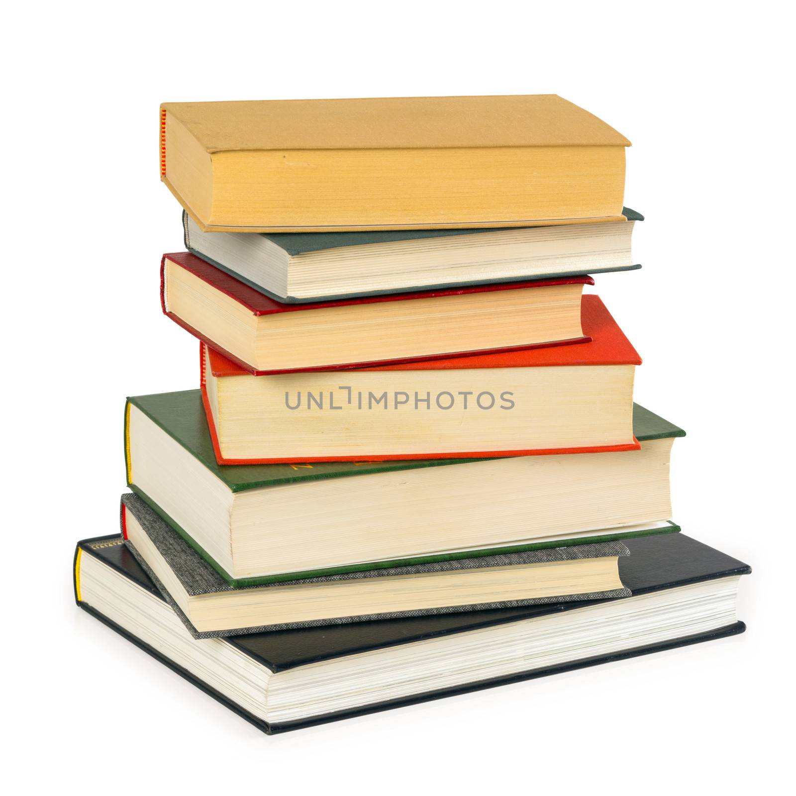 Photo of a small pile of old books isolated on white background