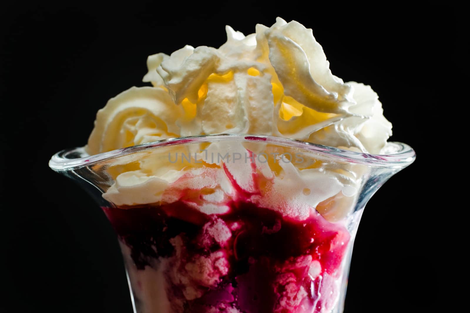 Ice cream in the glass on a black background