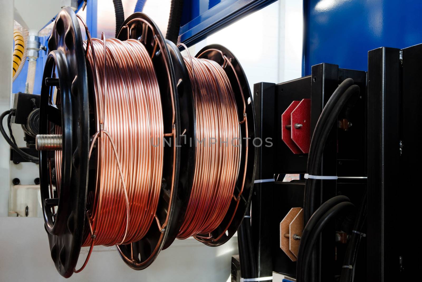 shiny copper wire on spools in the shop