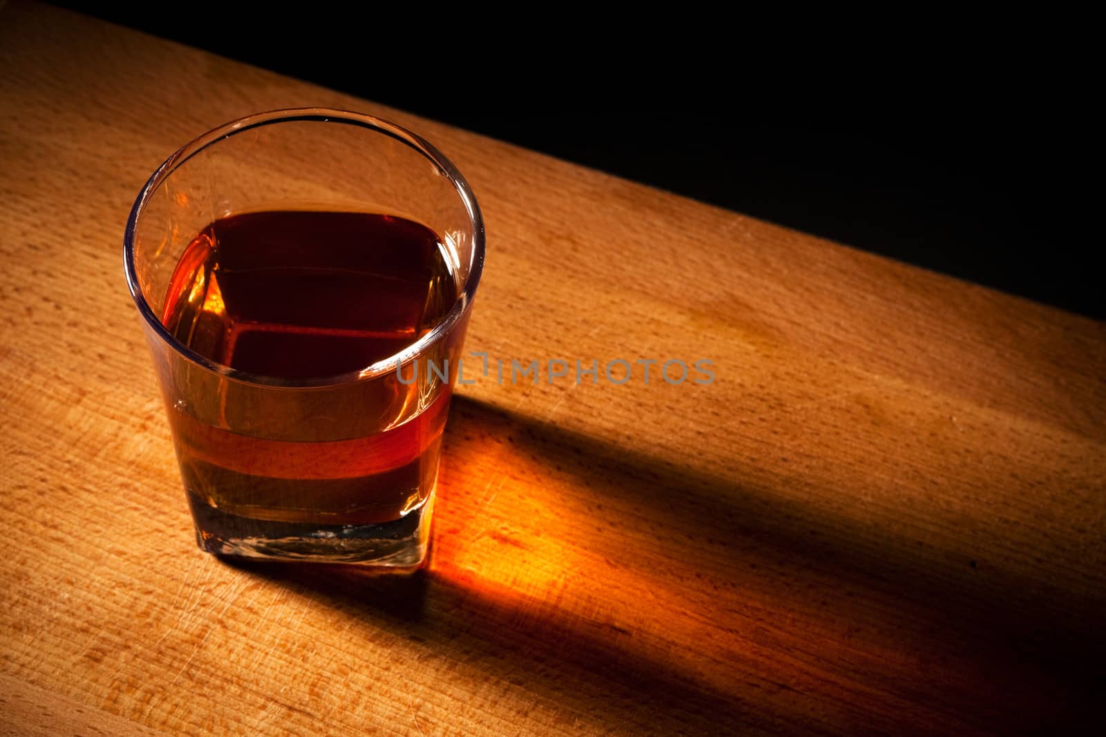 glass from whisky on a wooden table