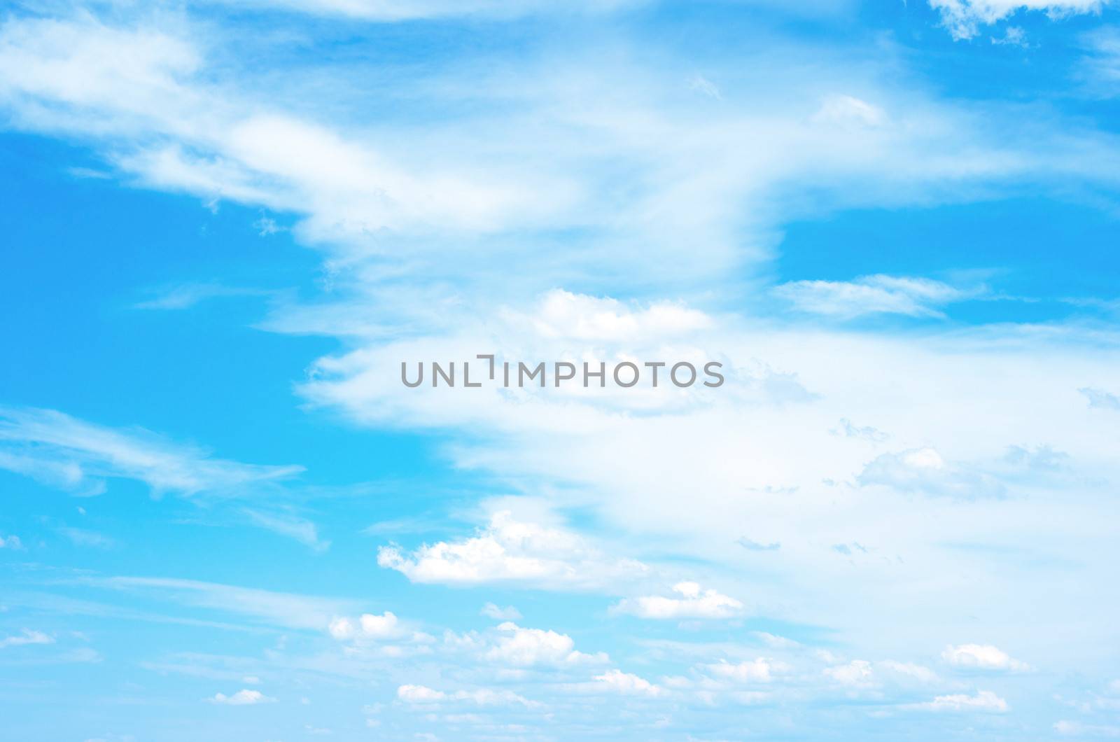 Blue sky background with a tiny clouds