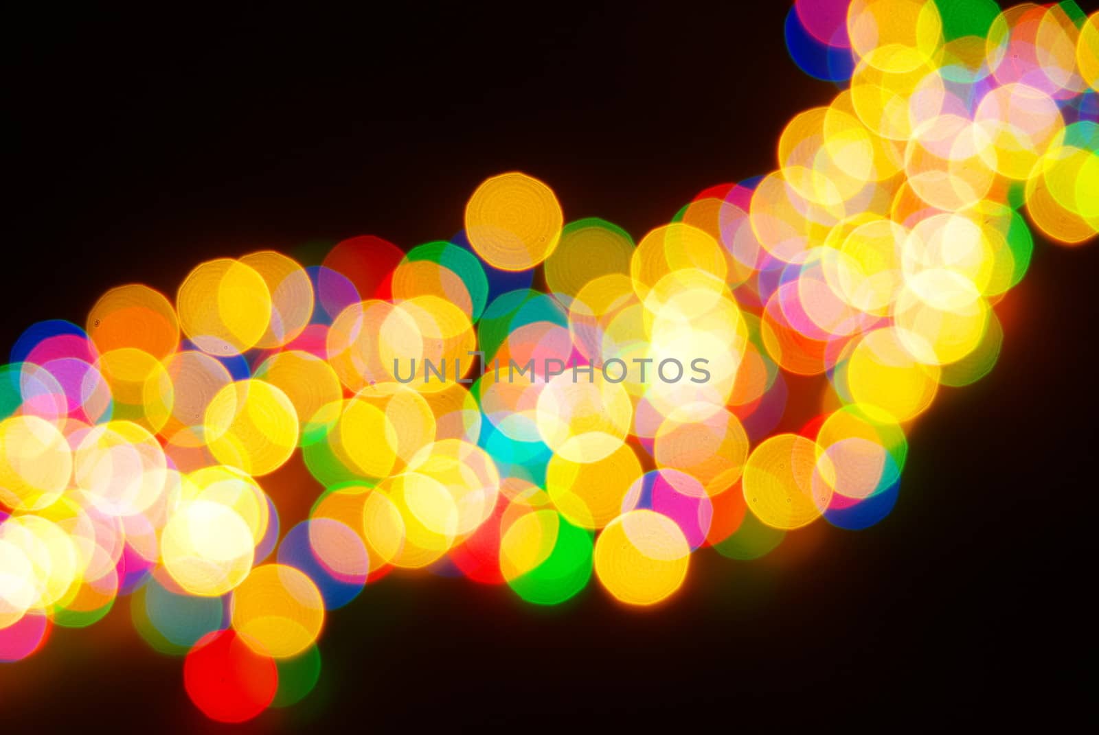 Abstract christmas lights as background on black