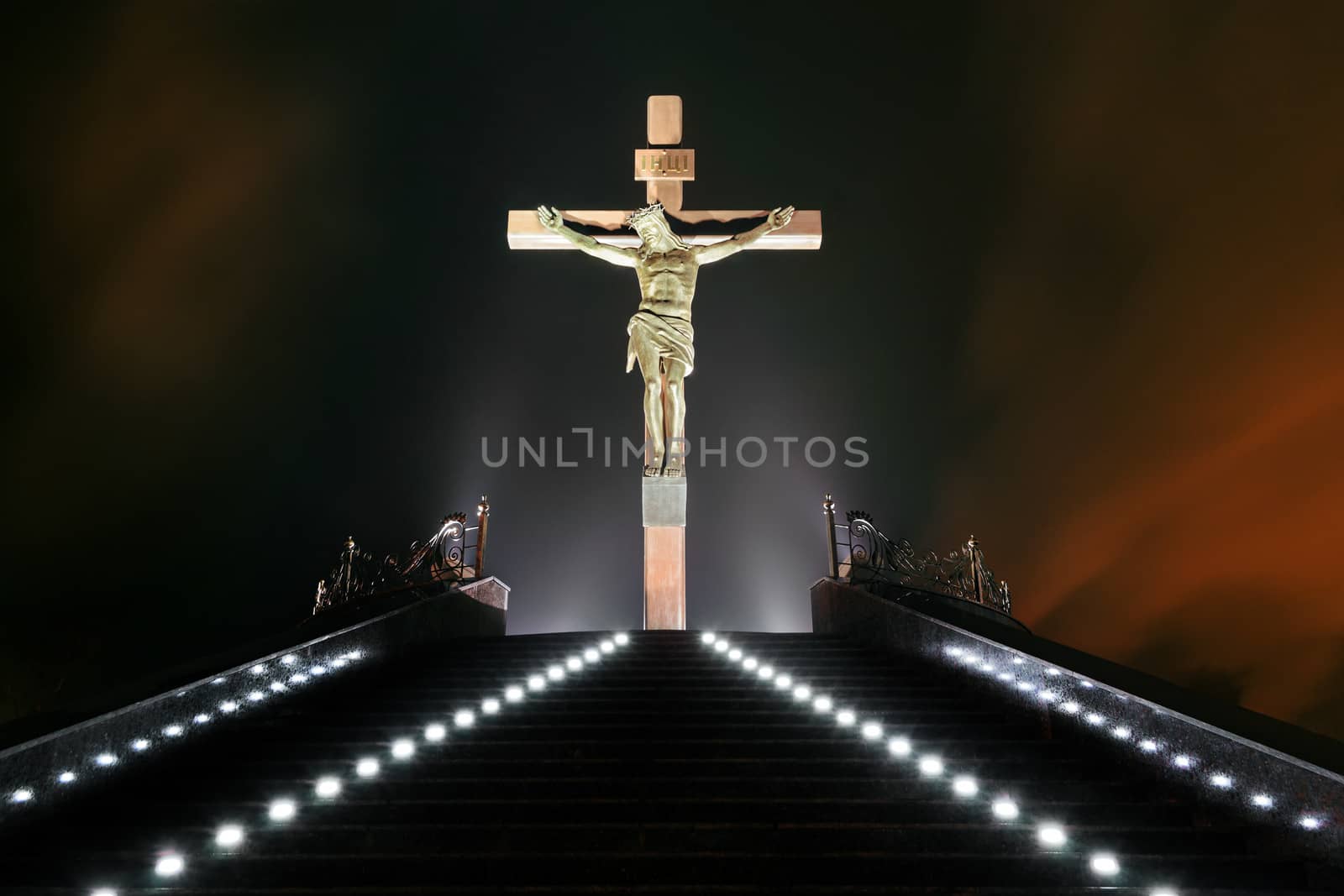Statue of the crucifixion at night. Dniprodzerzhyns'k, Ukraine.