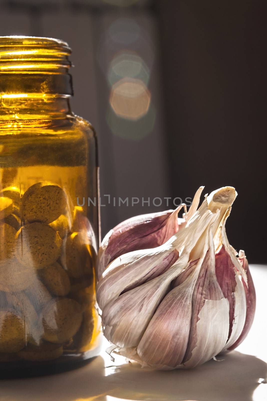 Garlic capsules, vitamins d pills  by digicomphoto