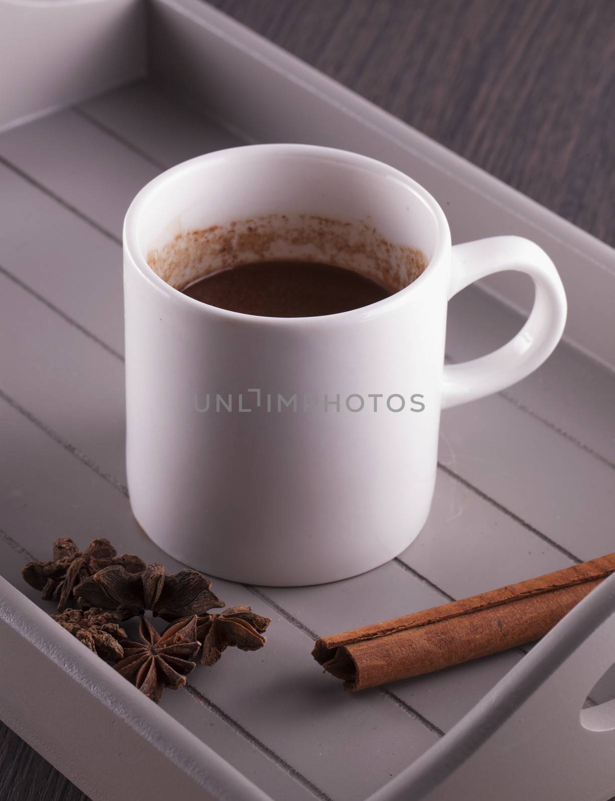 Hot chocolate cup with cinnamon and star anise