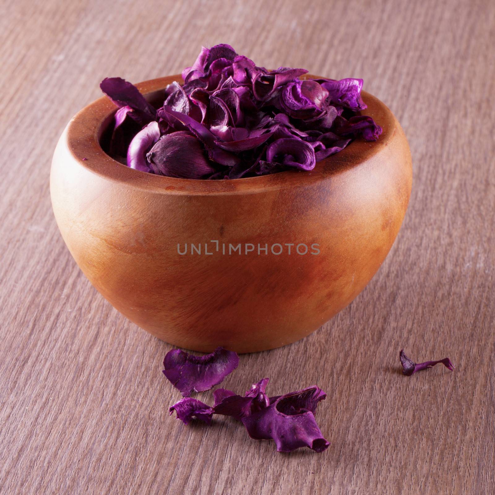 Purple pot pourri in a wooden cup