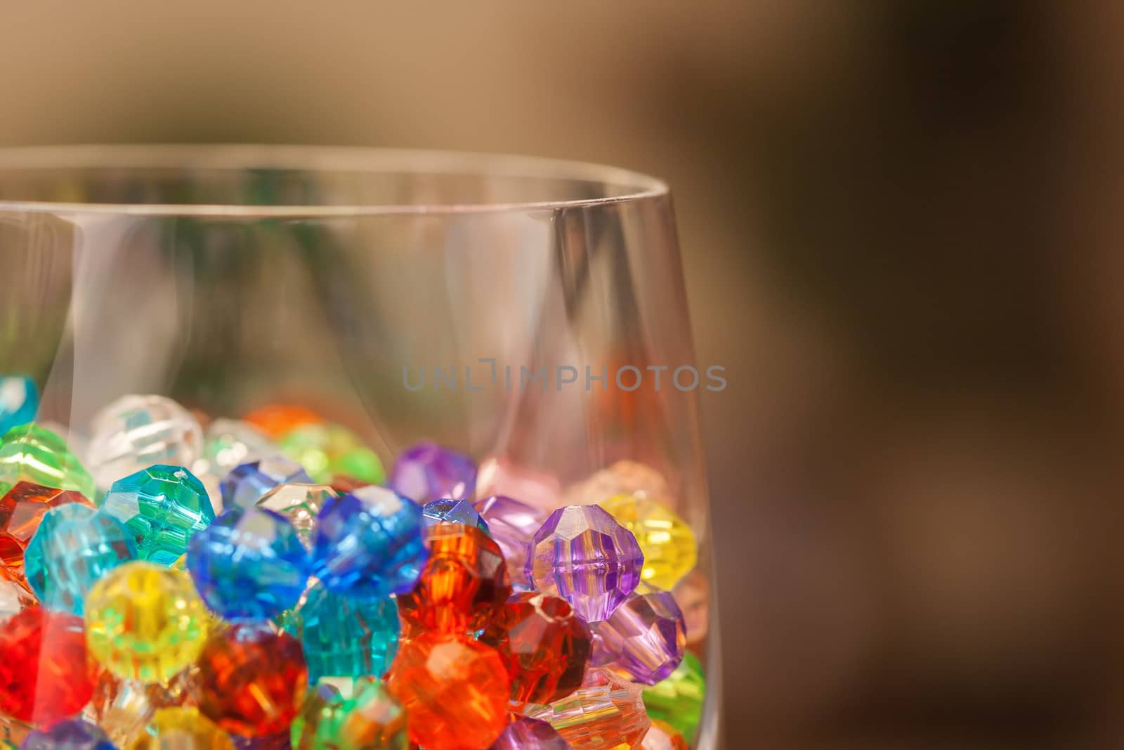 Plastic colored Beads in a wine glass