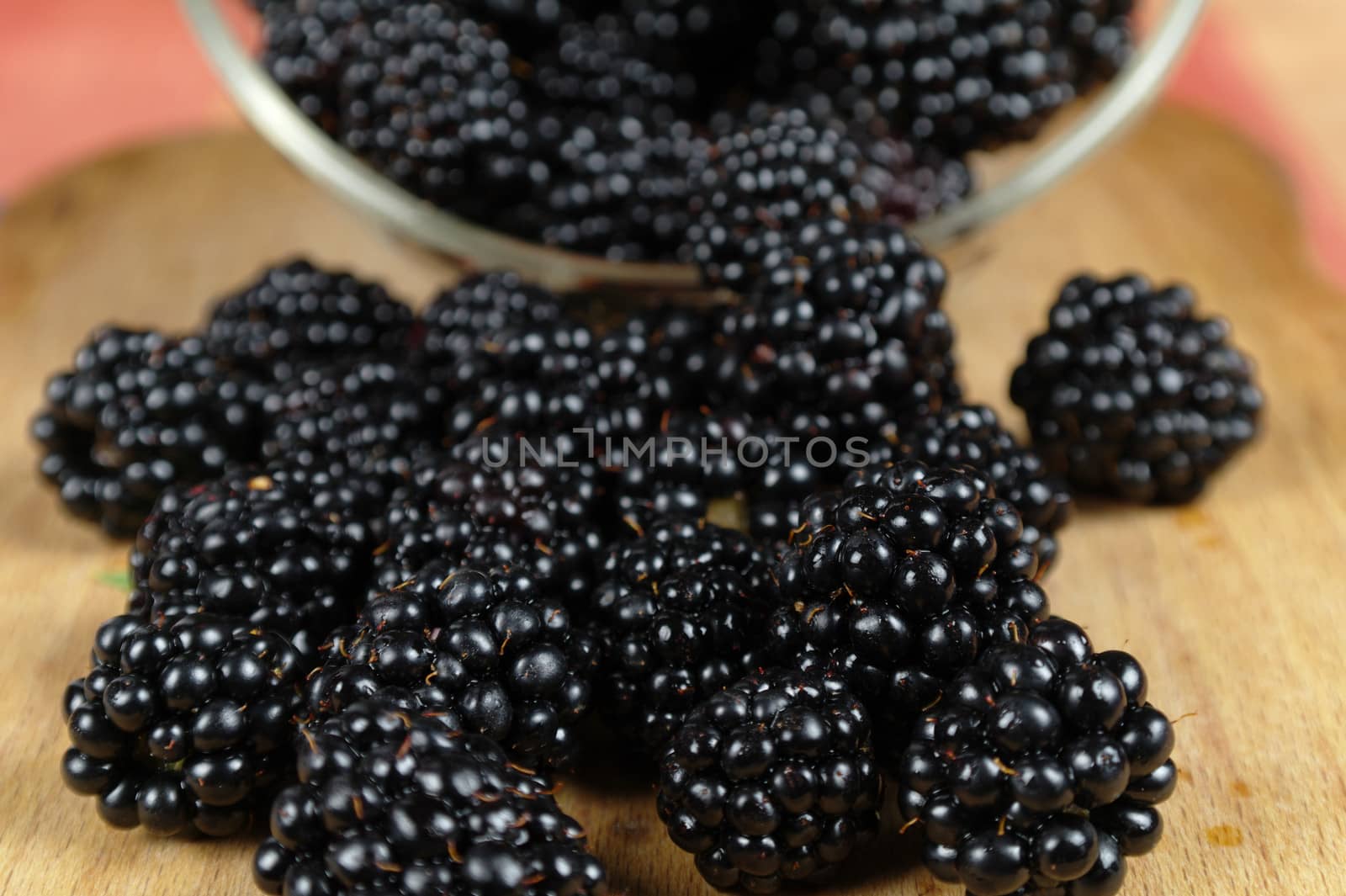 scattered mulberries on a kitchen board