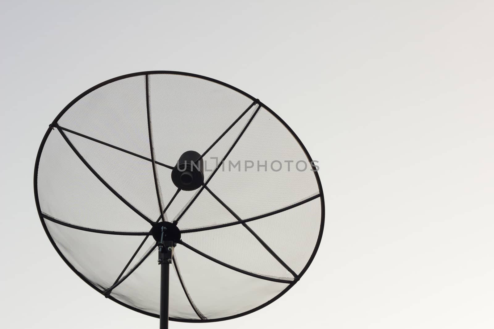 Black antenna communication satellite dish over white sky without cloud