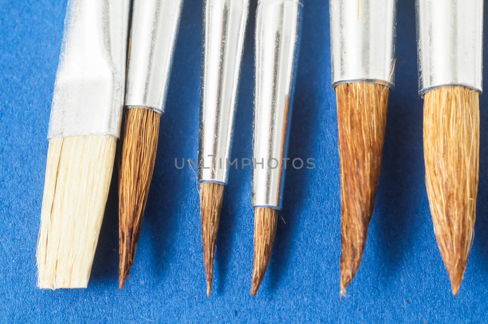 New Wooden Different Paintbrush Set Texture over a Colored Background