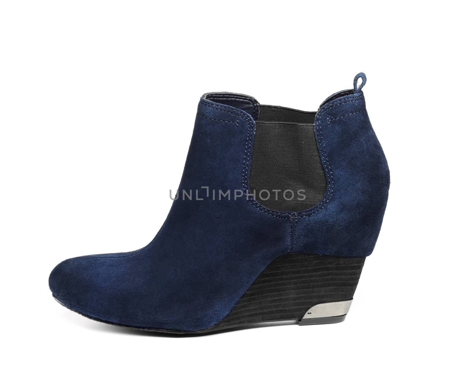 Blue suede woman's boots over white background