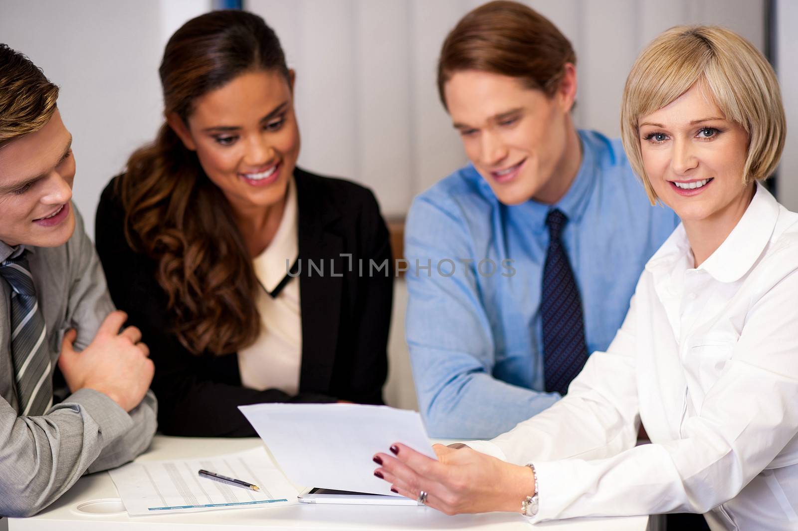 Group of happy business people conducting a meeting