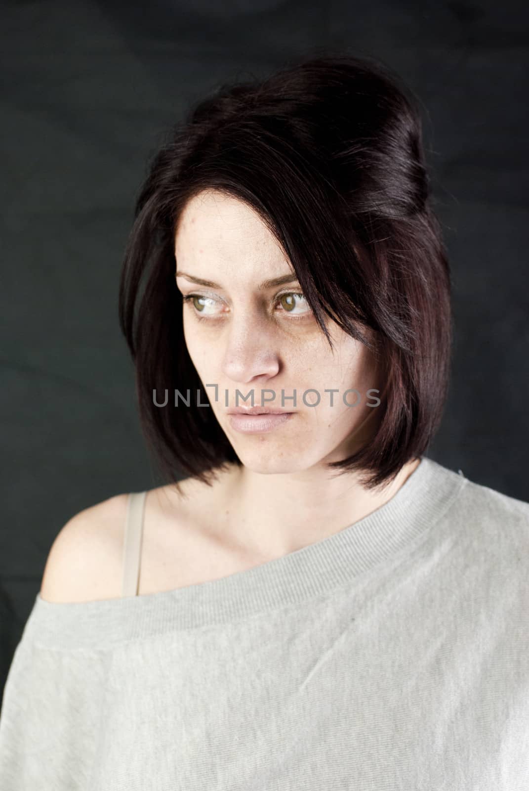 conceptual portrait of stressed abused young woman 