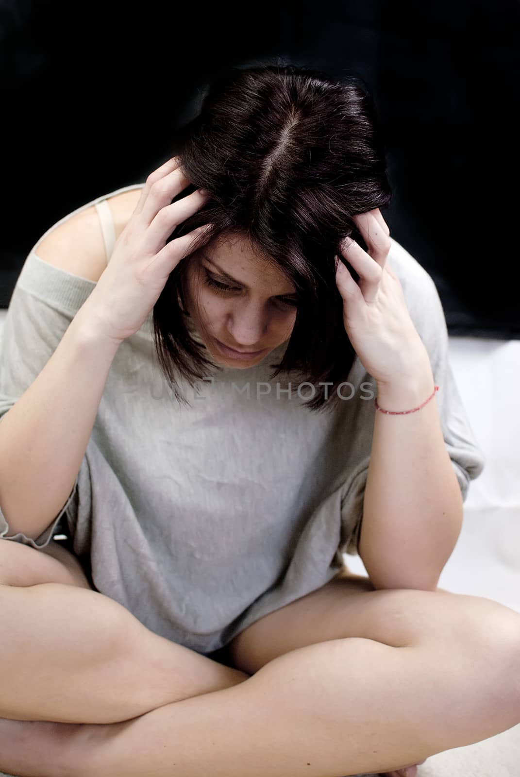 conceptual portrait of stressed abused young woman 