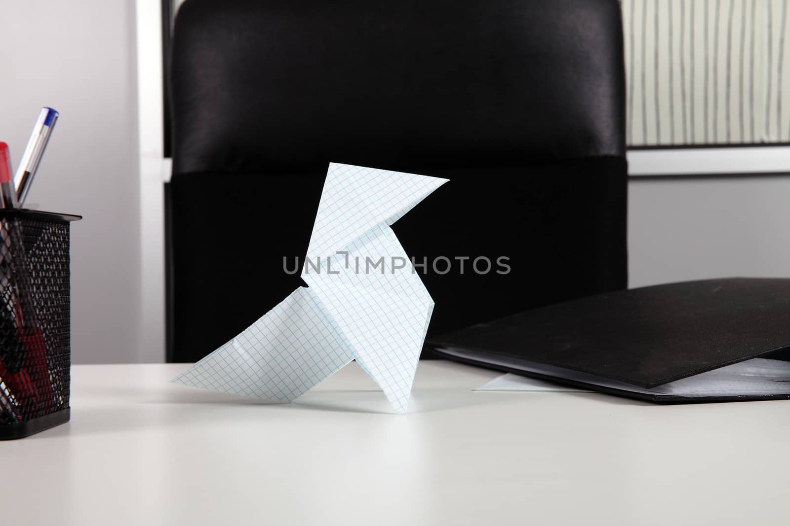 worker wasting time with origami