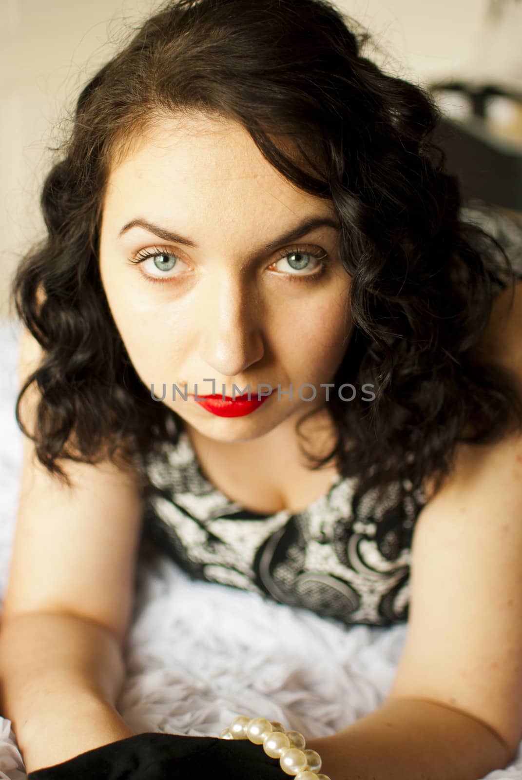 sansual retro girl portrait lying on a bed