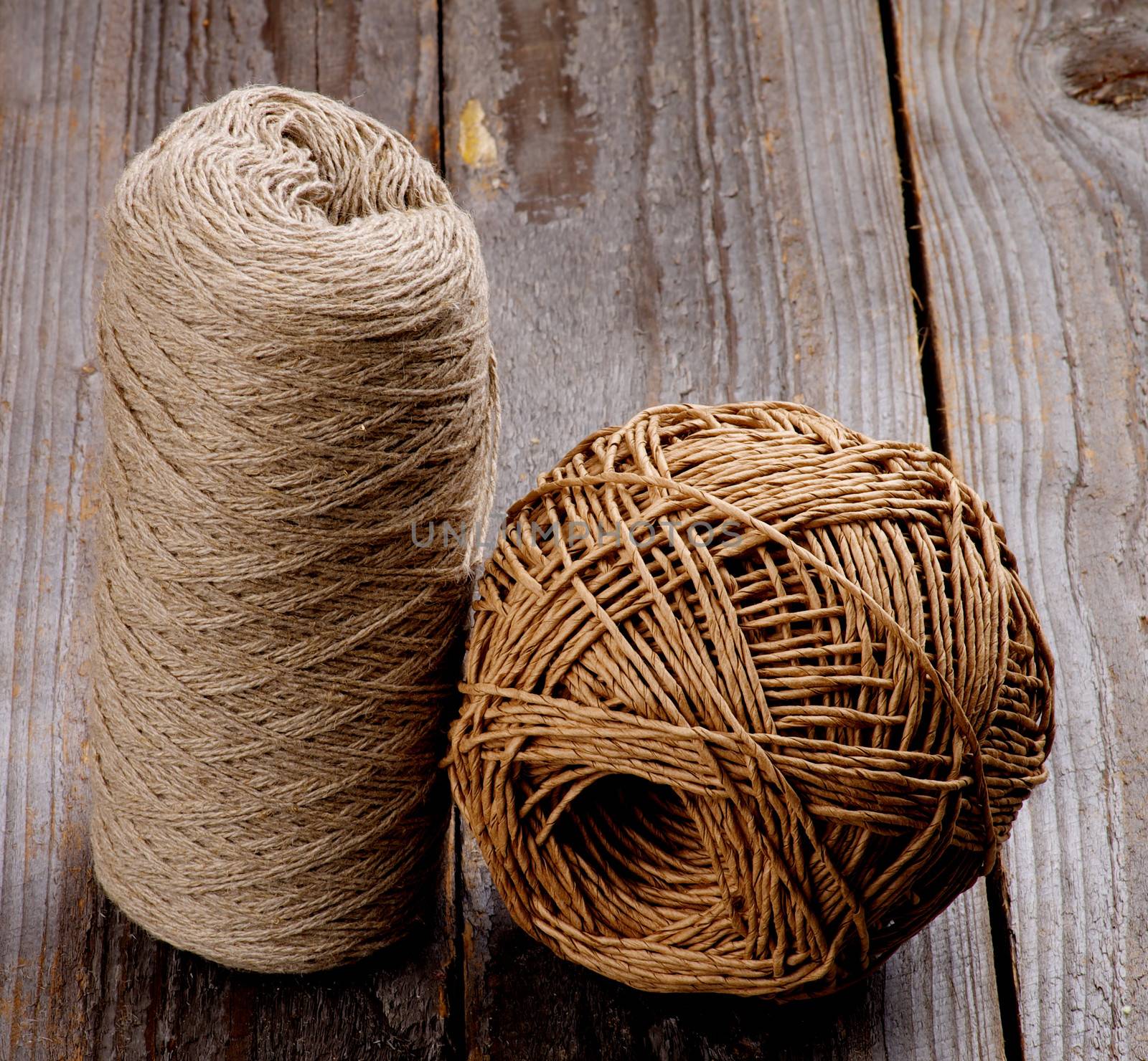 Two Balls of String Twine isolated on Rustic Wooden background