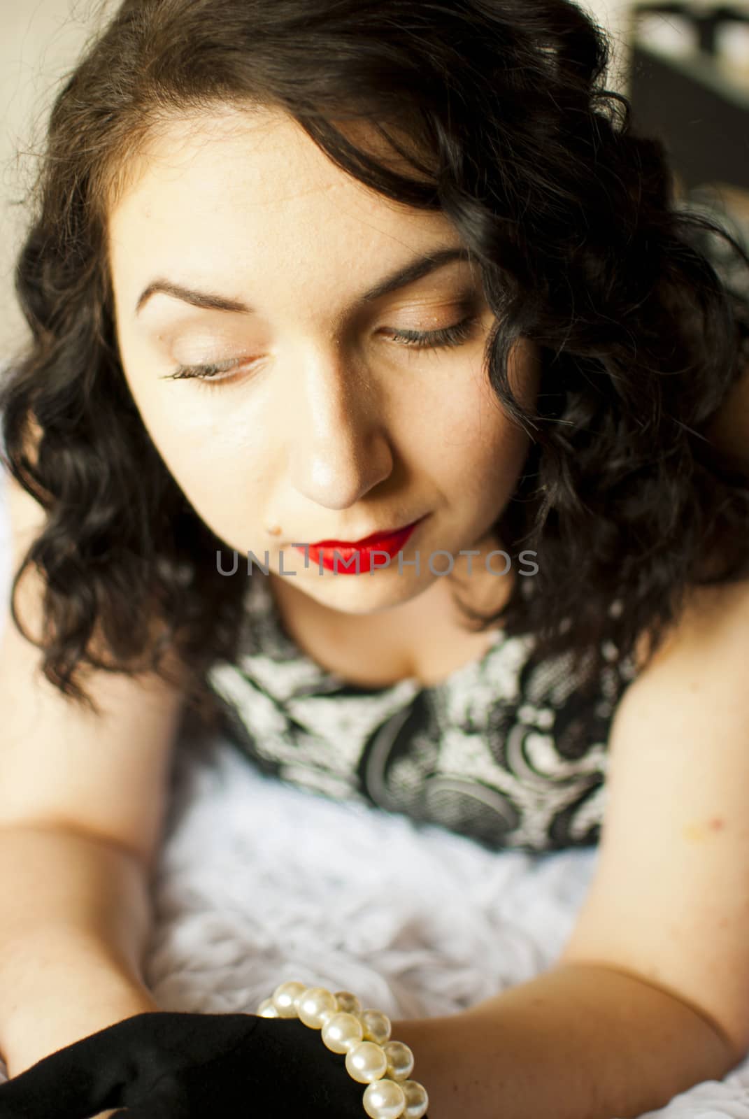sansual retro girl portrait lying on a bed