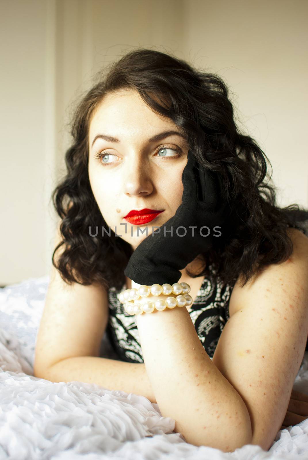 sansual retro girl portrait lying on a bed