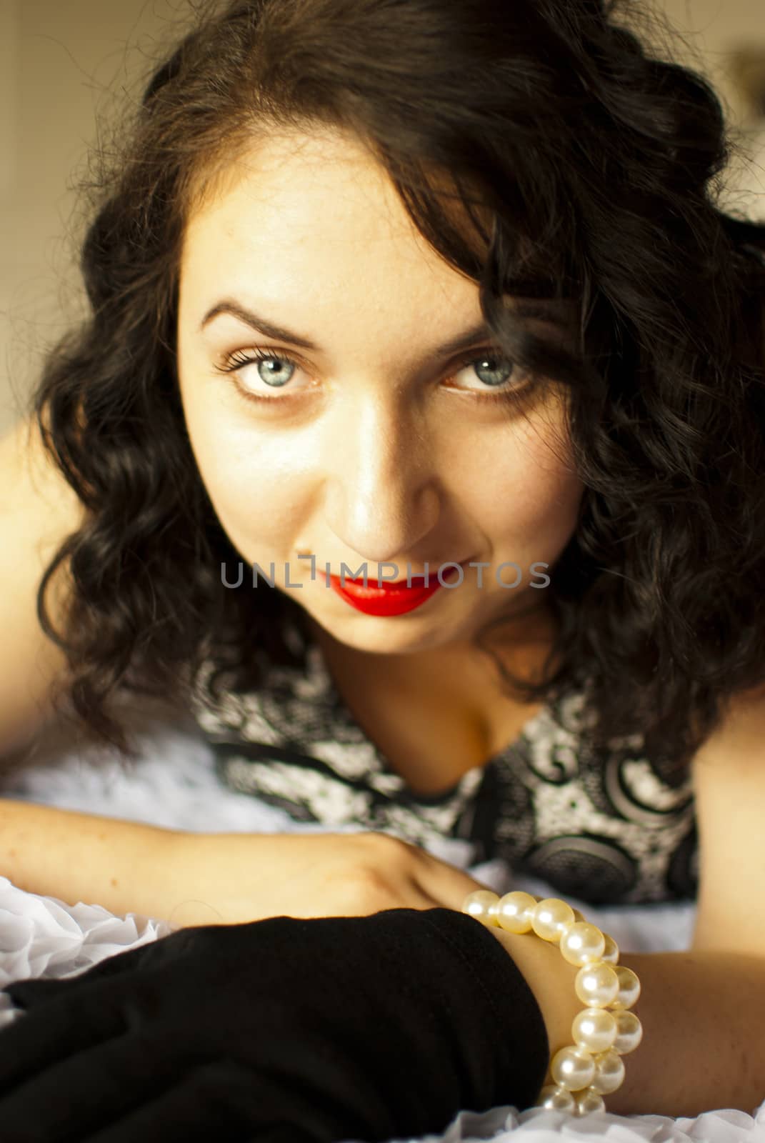sansual retro girl portrait lying on a bed