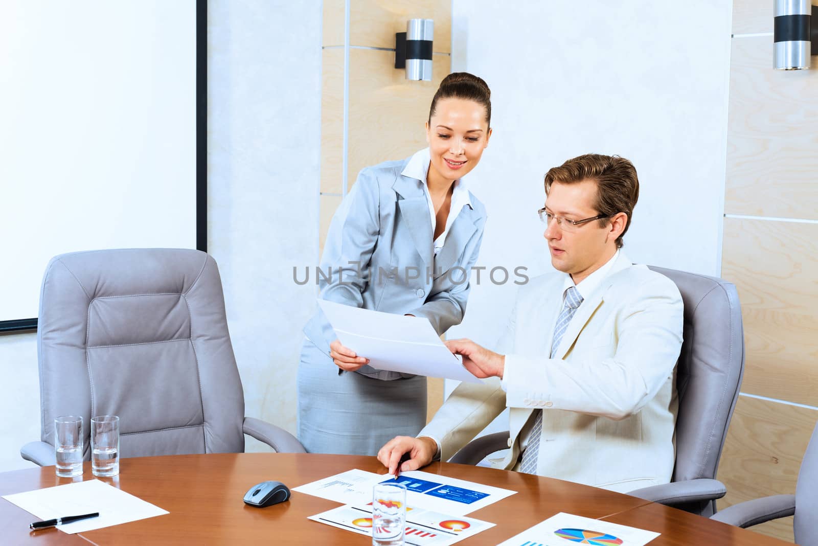 image of a two businessmen discussing documents, teamwork