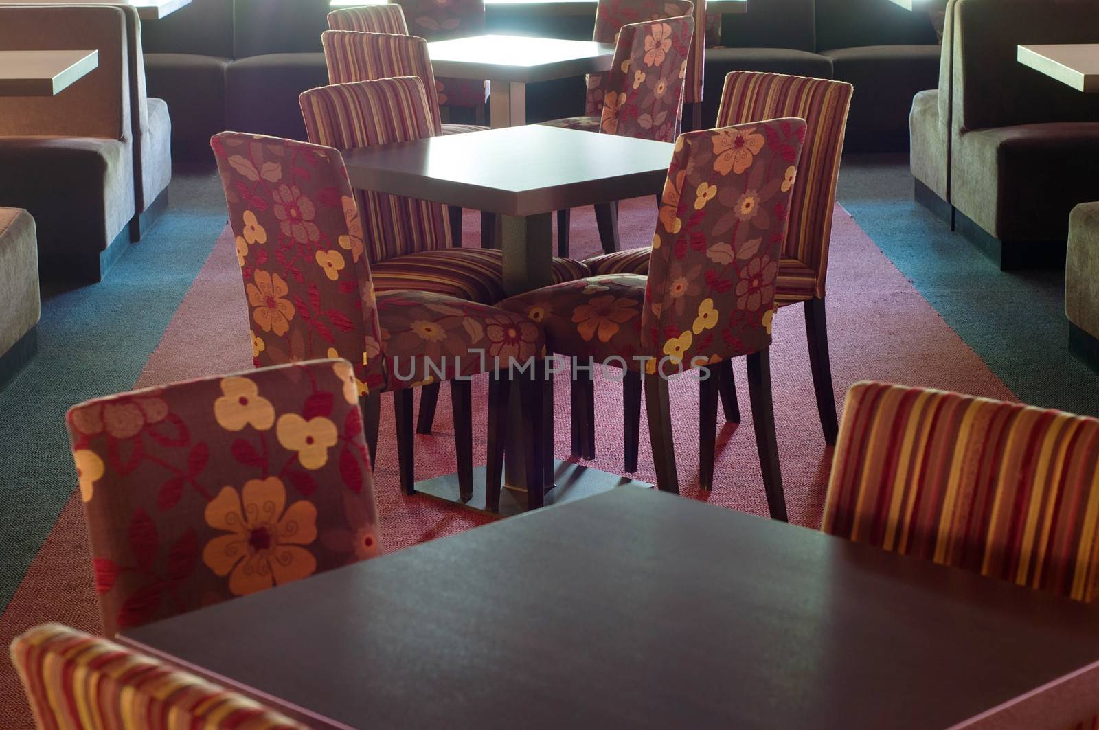 Shot of tables and chairs in billiard room