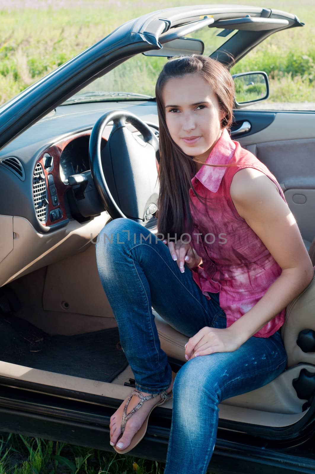 Outdoor shot of beautiful brunette woman with long hair