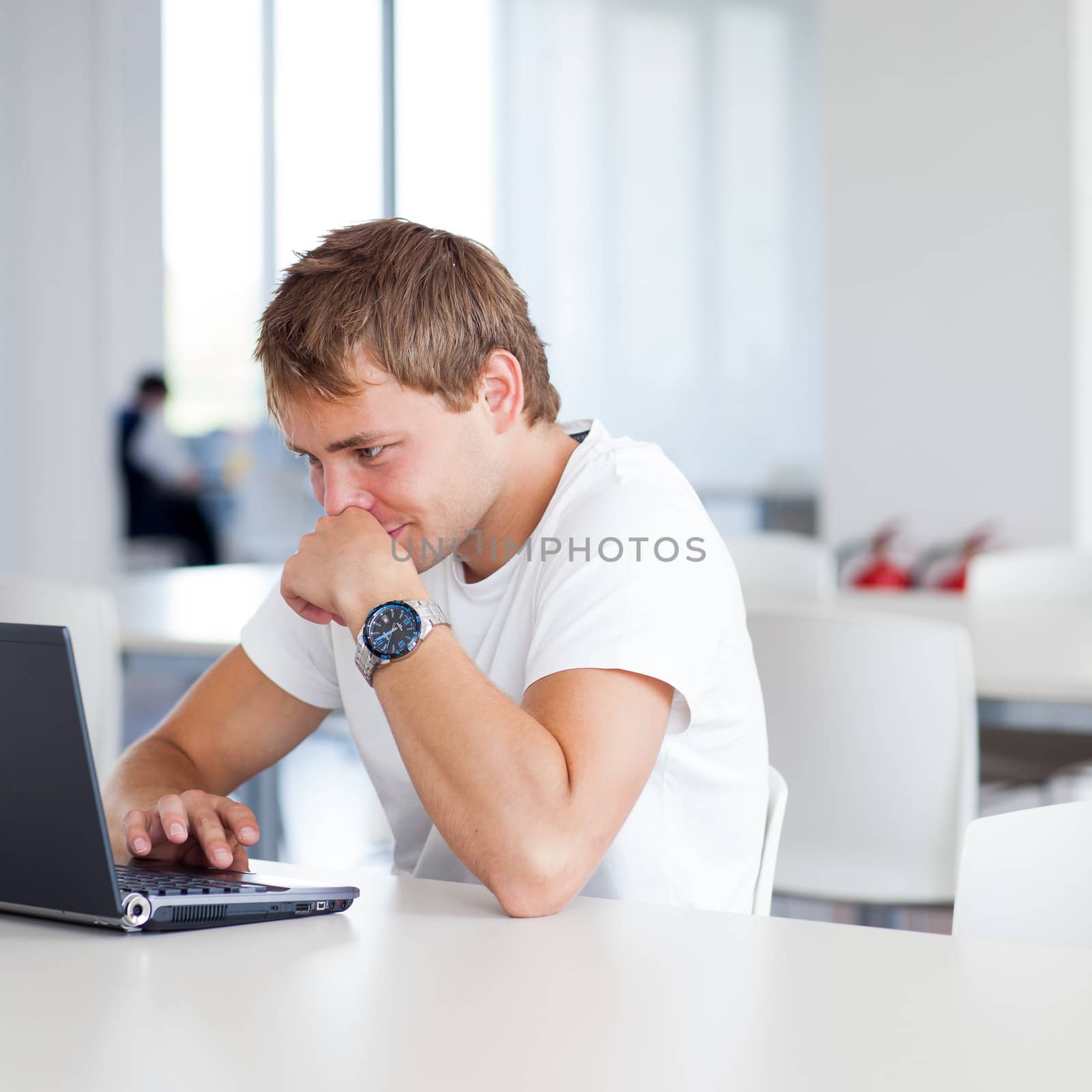 handsome college student with laptop computer by viktor_cap