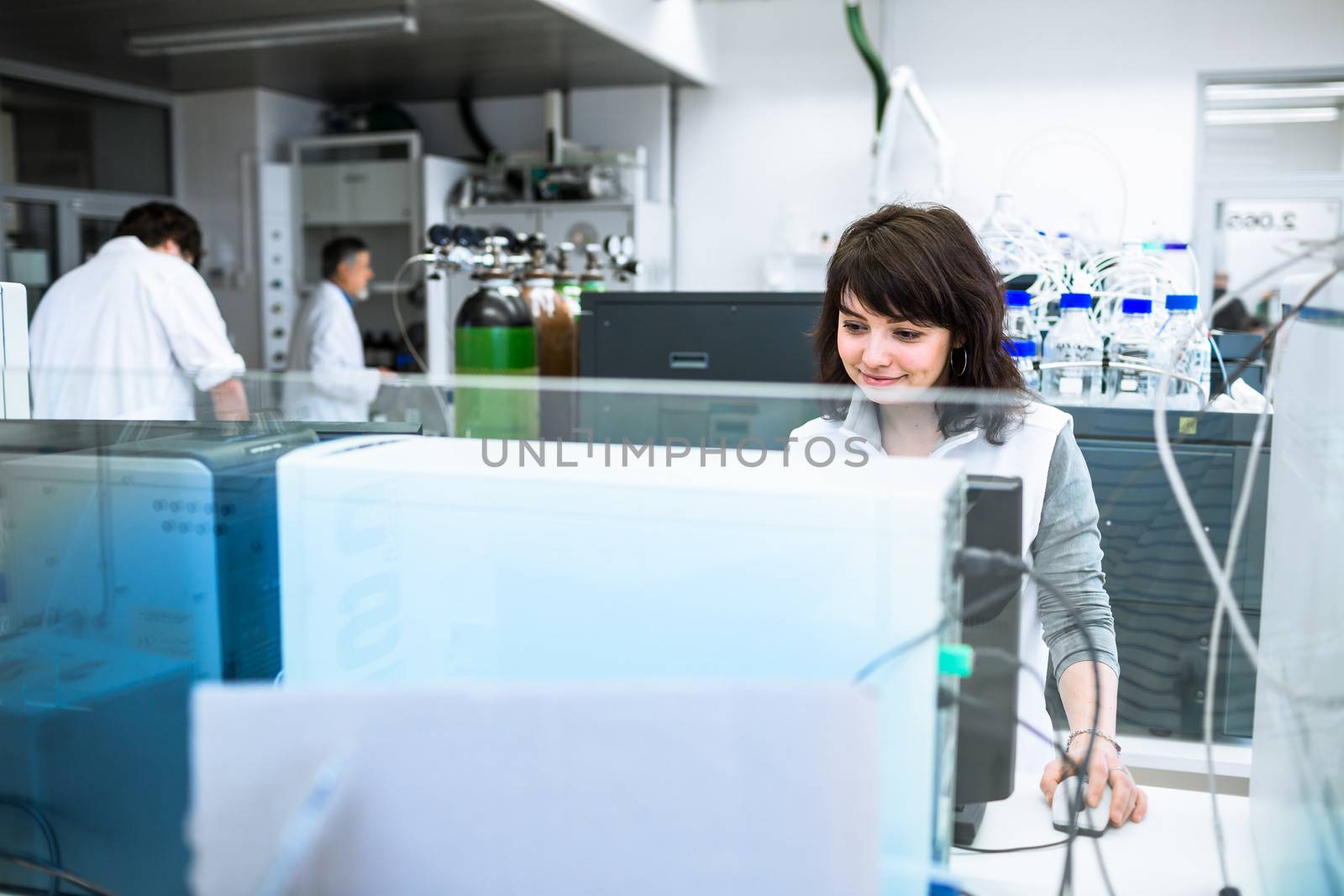 Portrait of a female researcher doing research in a lab (shallow by viktor_cap