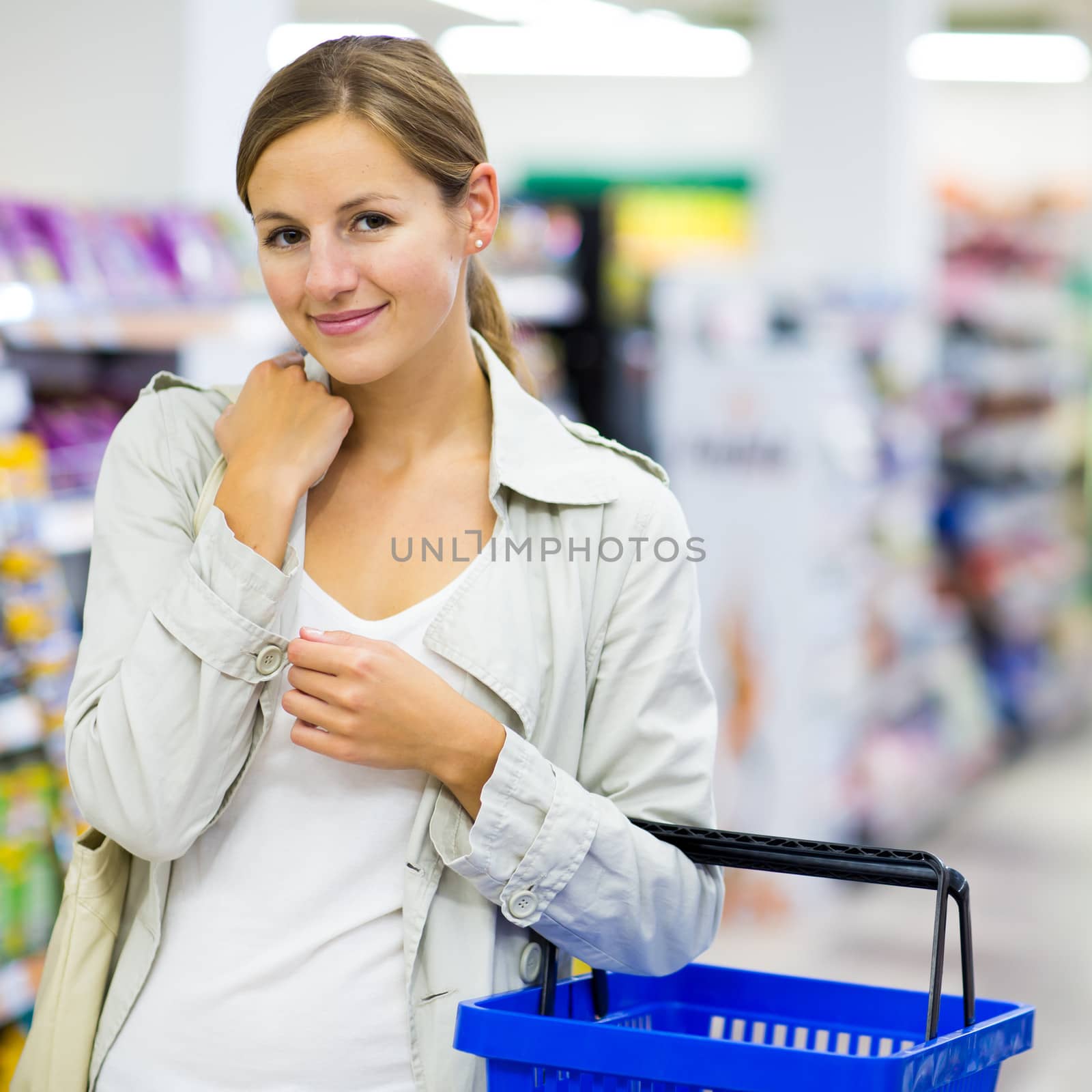Beautiful young woman shopping in a grocery store/supermarket by viktor_cap