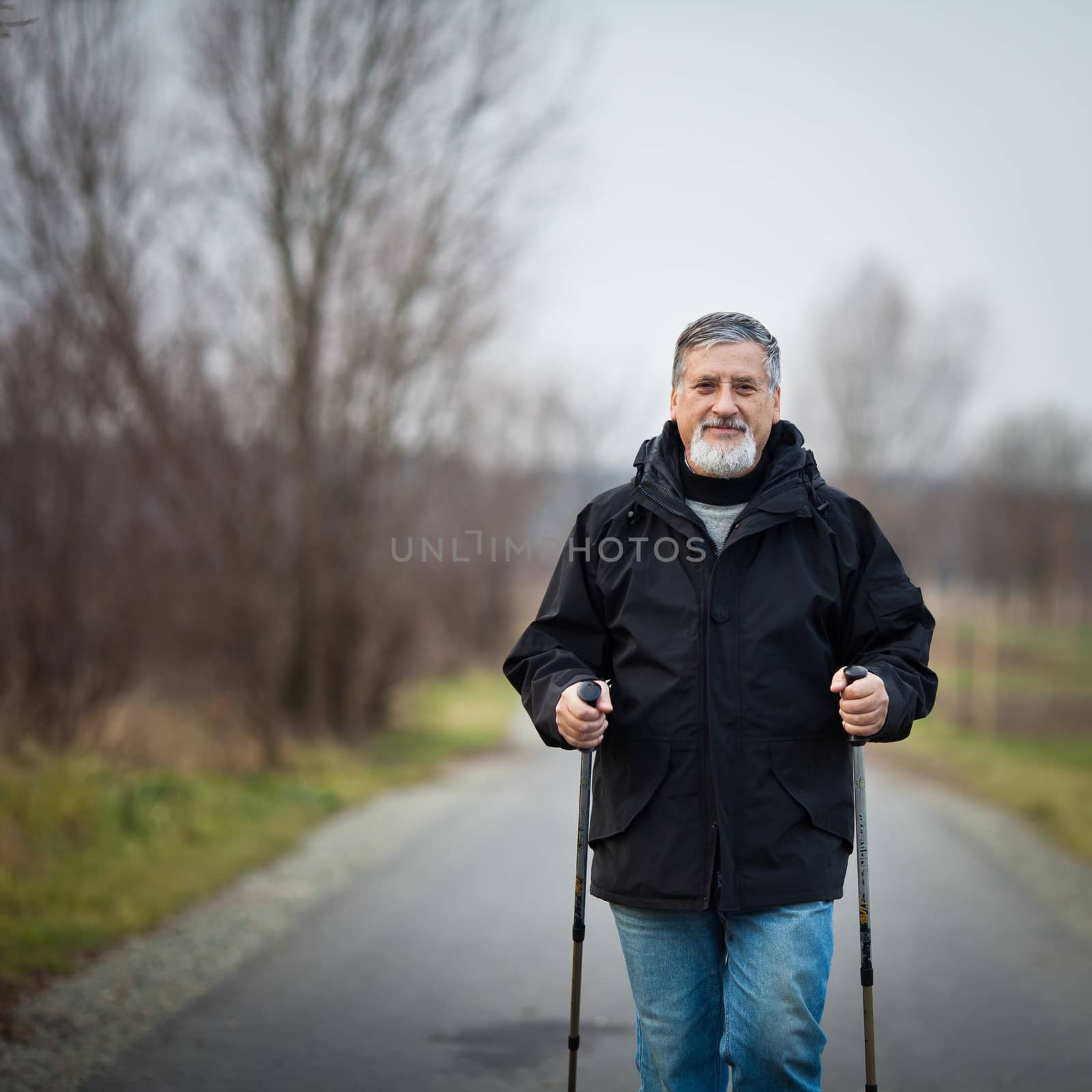 Senior man nordic walking, enjoying the outdoors, the fresh air, by viktor_cap