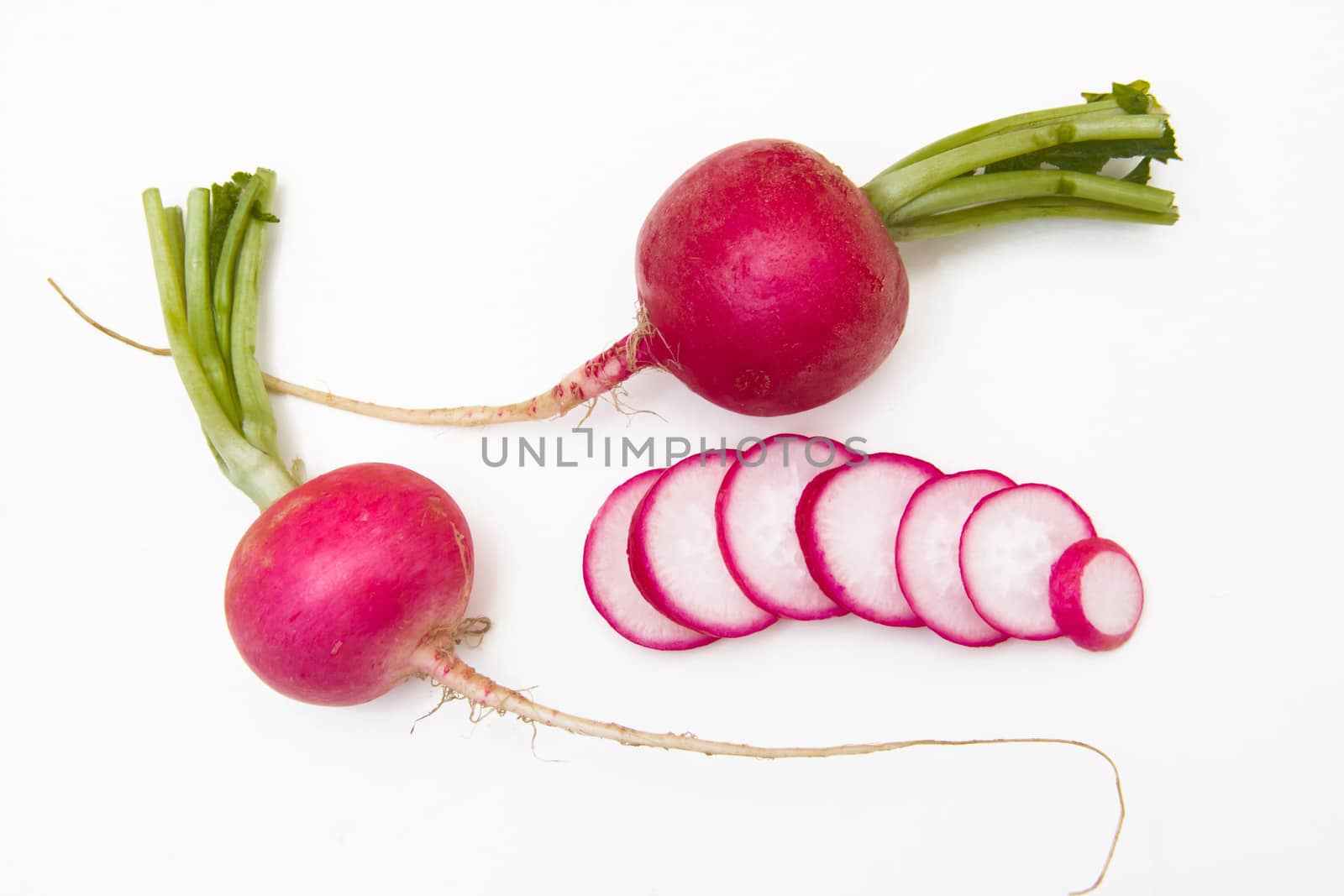 Sliced radishes on white background