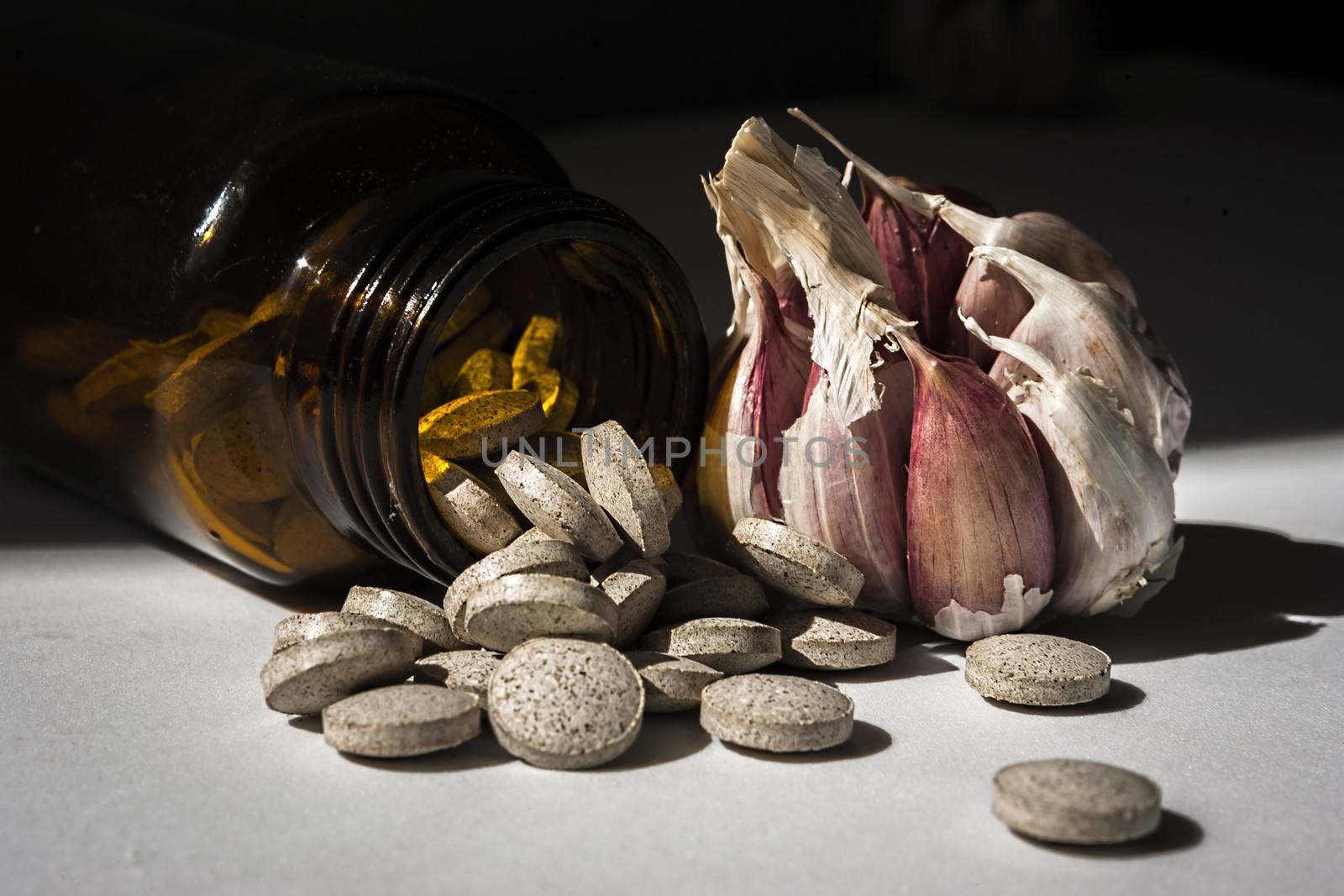 Garlic capsules, vitamins d pills  by digicomphoto