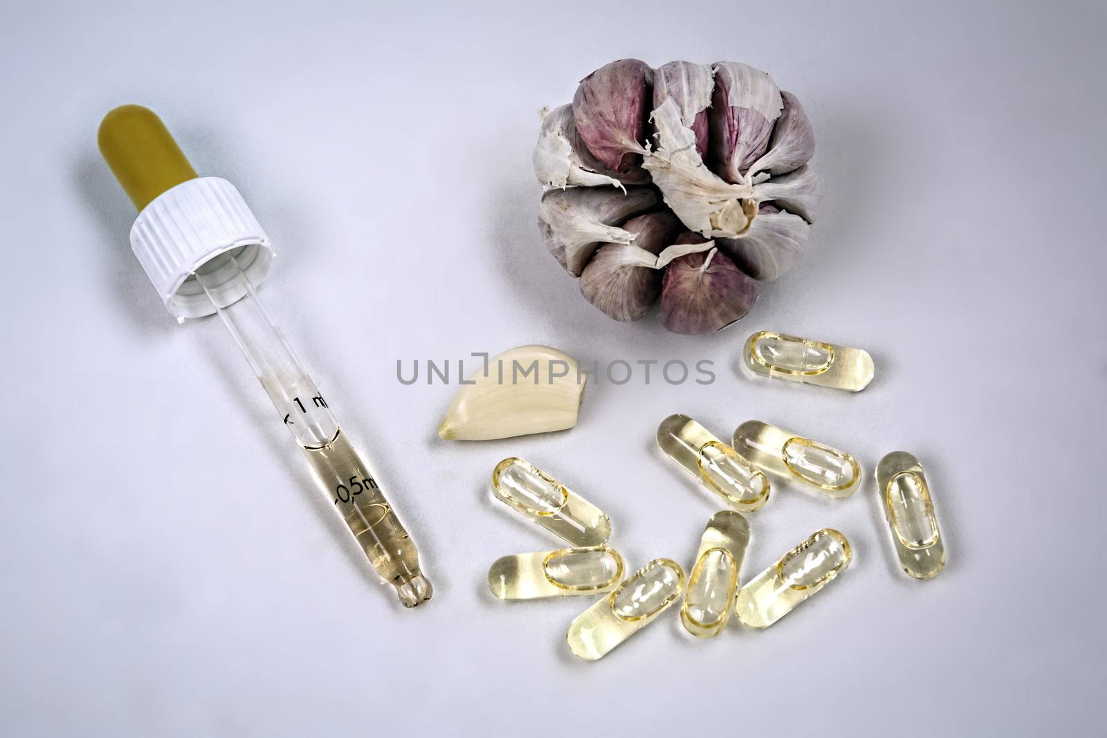 Garlic oil capsules, vitamins d pills  by digicomphoto