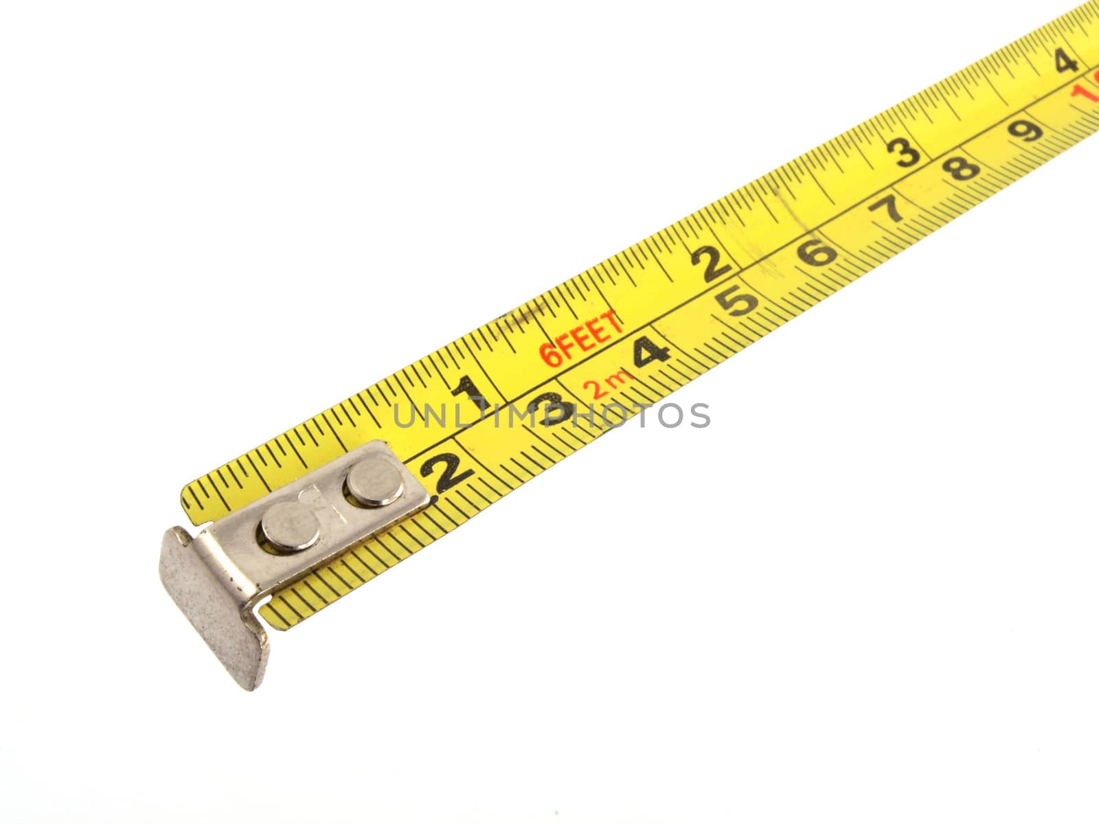 Close up photo of a yellow tape measure on a white background.