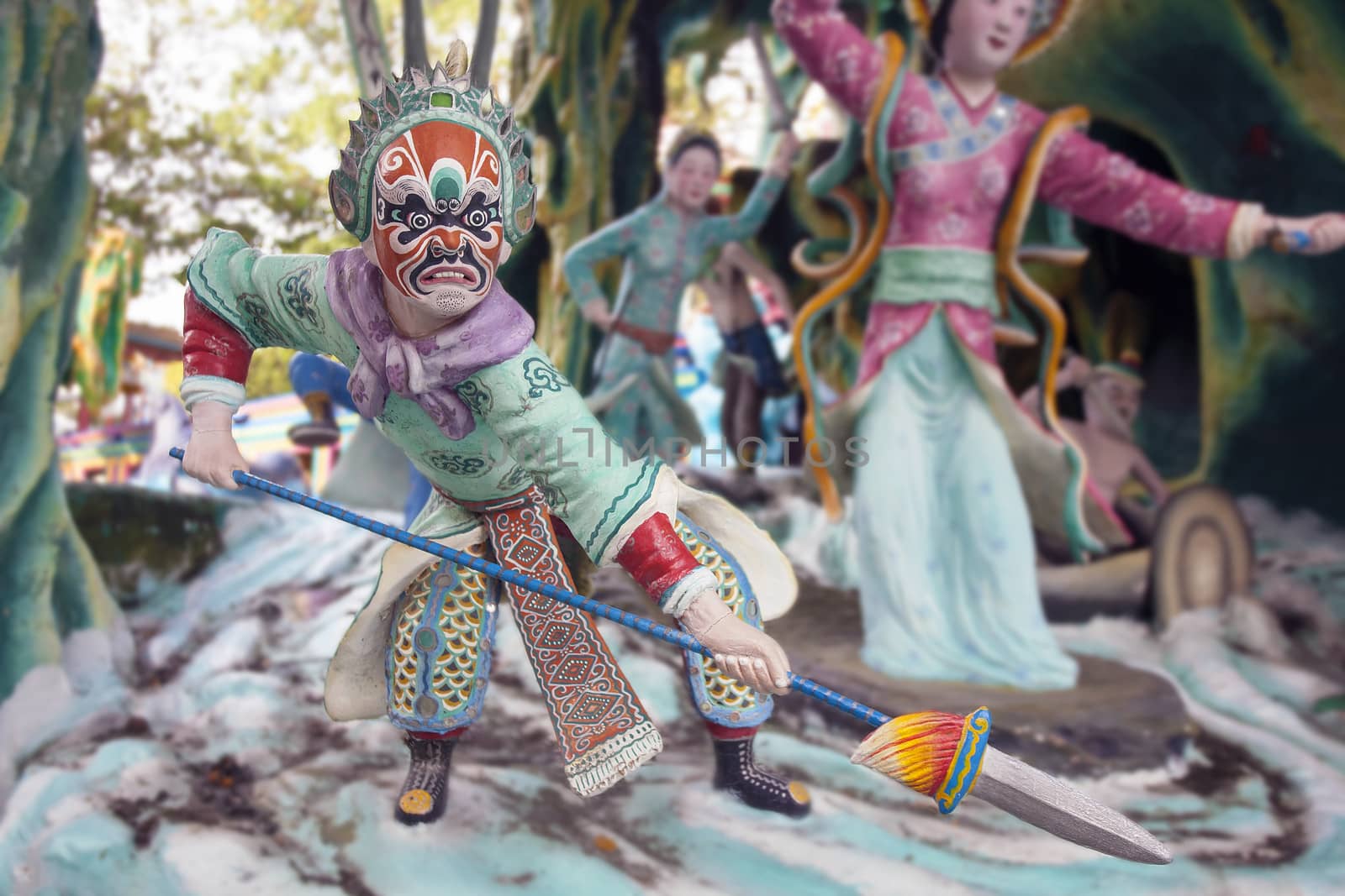 SINGAPORE - FEBRUARY 1, 2014: Ancient Chinese Warrior with Painted Face holding spear at Haw Par Villa Theme Park. This theme park contains over 1,000 statues and 150 giant dioramas depicting scenes from Chinese mythology, folklore, legends, and history.