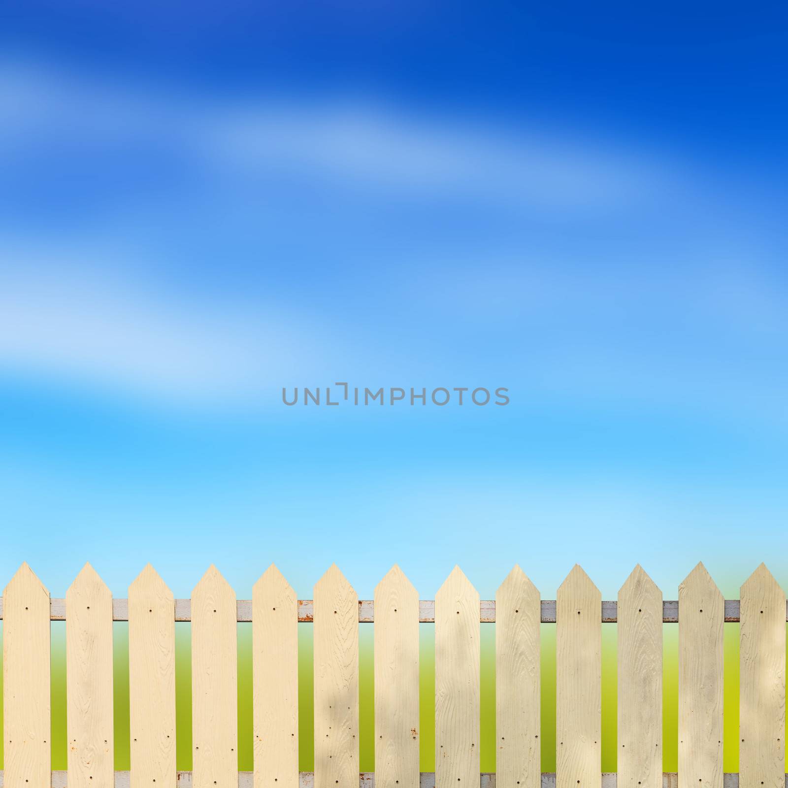 White fences with blue sky