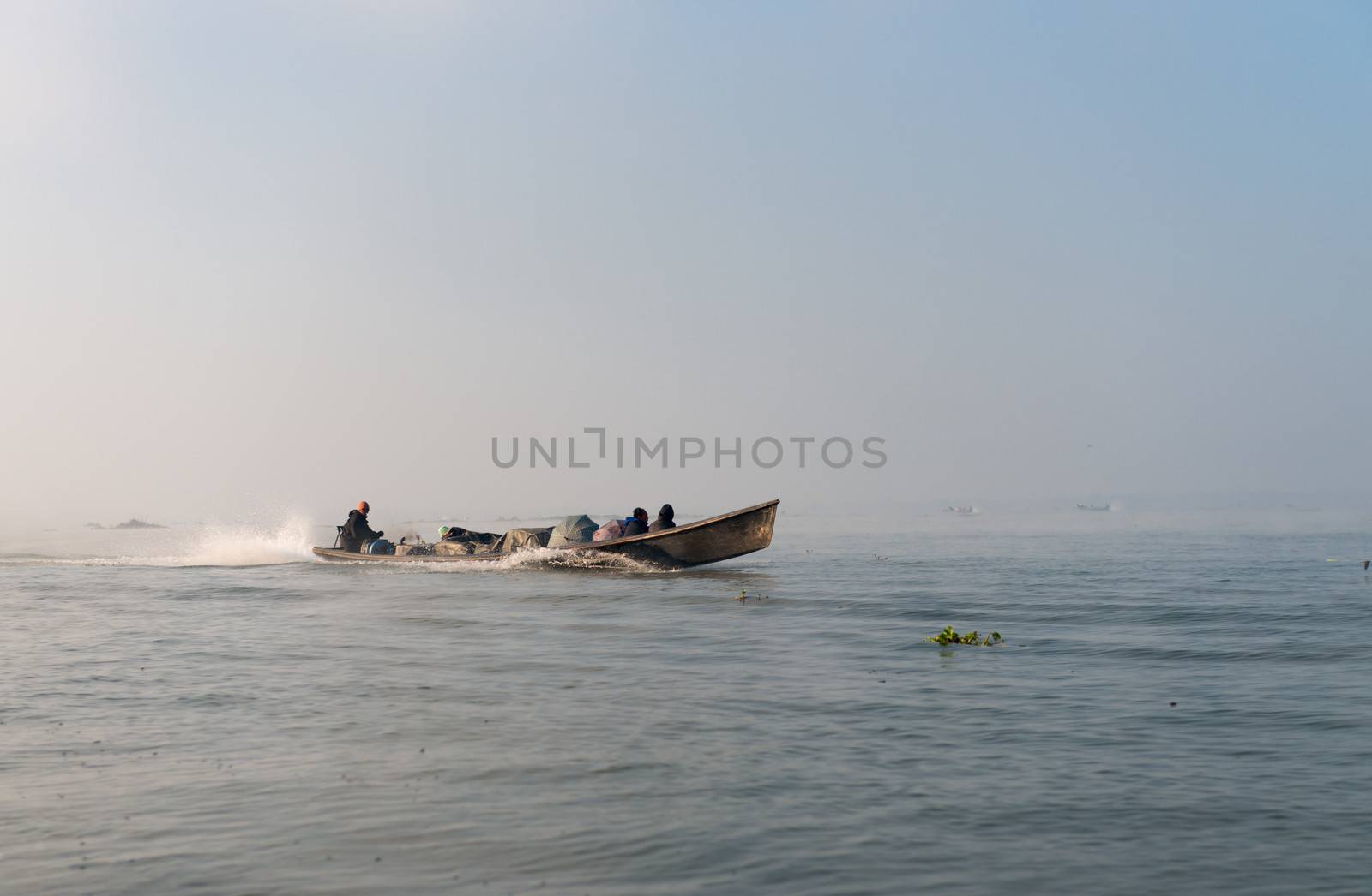 People transportation wooden long boat  by iryna_rasko