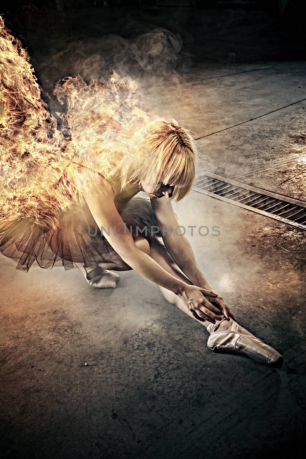 Sexy ballerina dancer with fire in the body