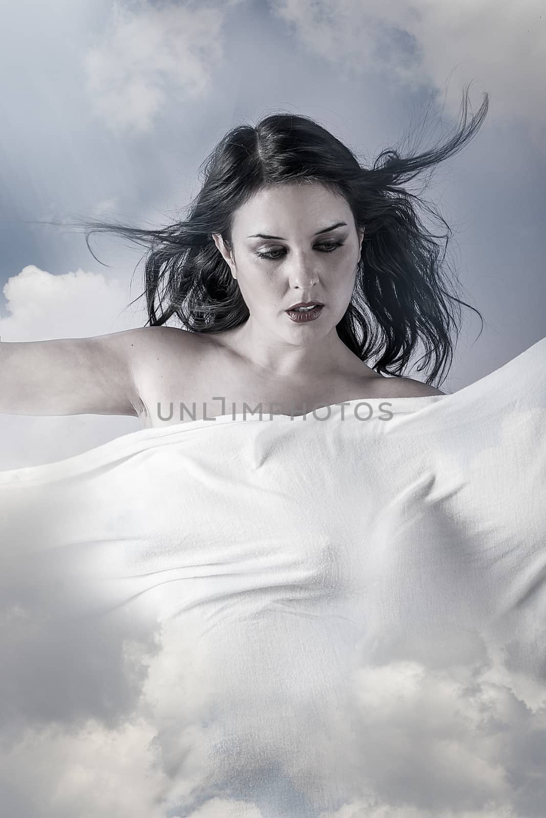 Environment, Beautiful woman in clouds, mithology concept. Brunette with long hair and white dress.