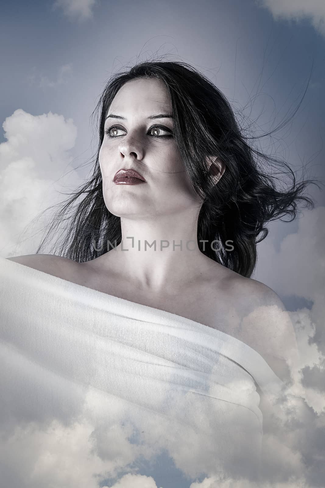 Skincare, Beautiful woman in clouds, mithology concept. Brunette with long hair and white dress.