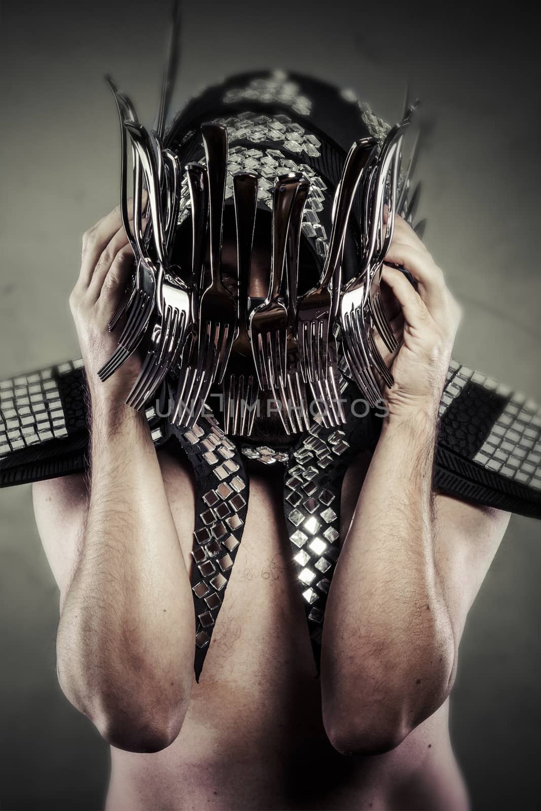 Man with helmet made ������with forks and knives, artistic concept