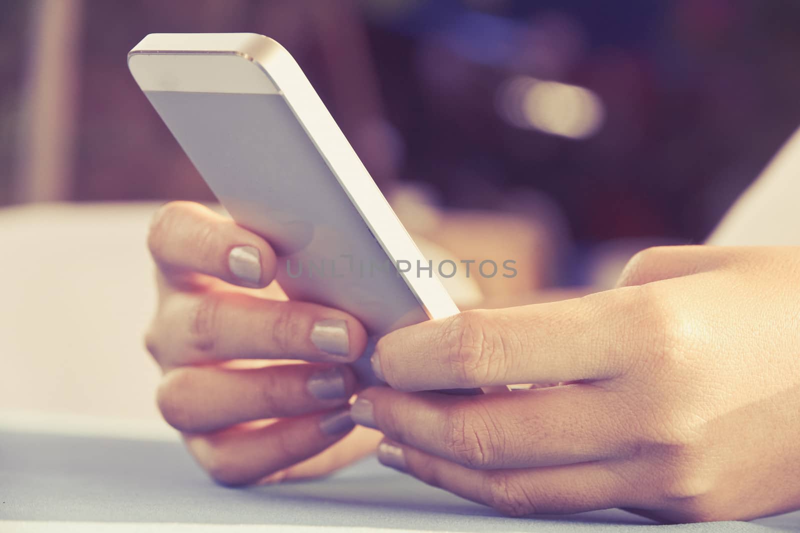 Teenage girl text messaging on her phone
