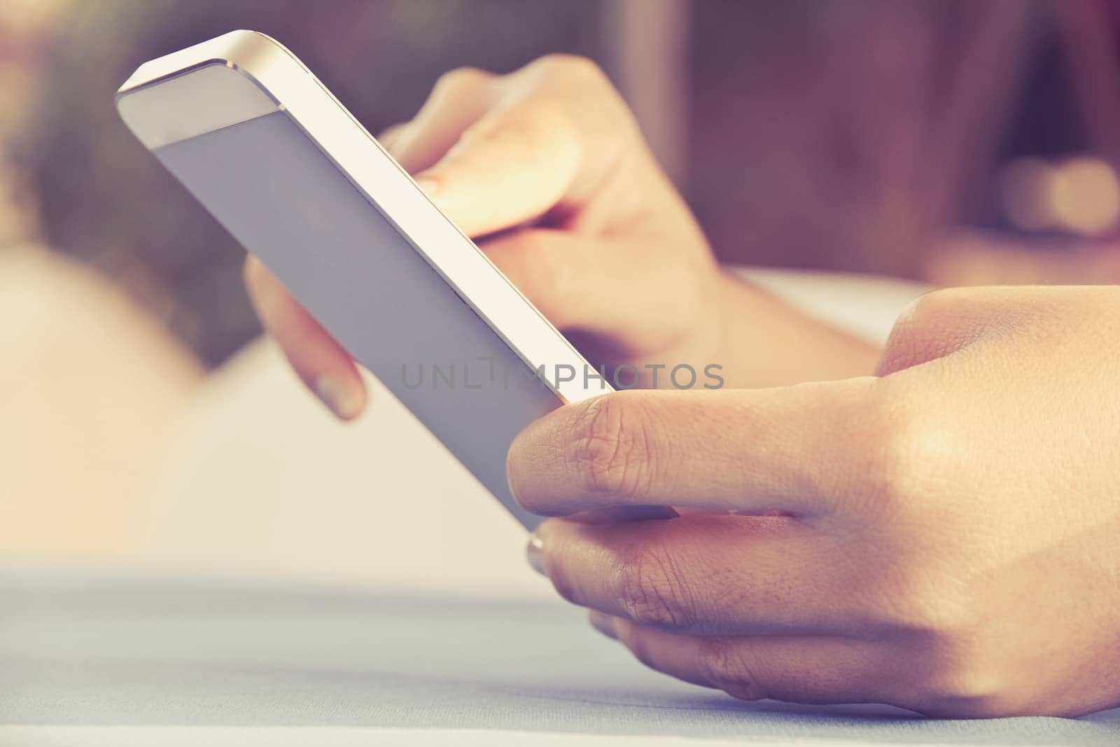 Teenage girl text messaging on her phone