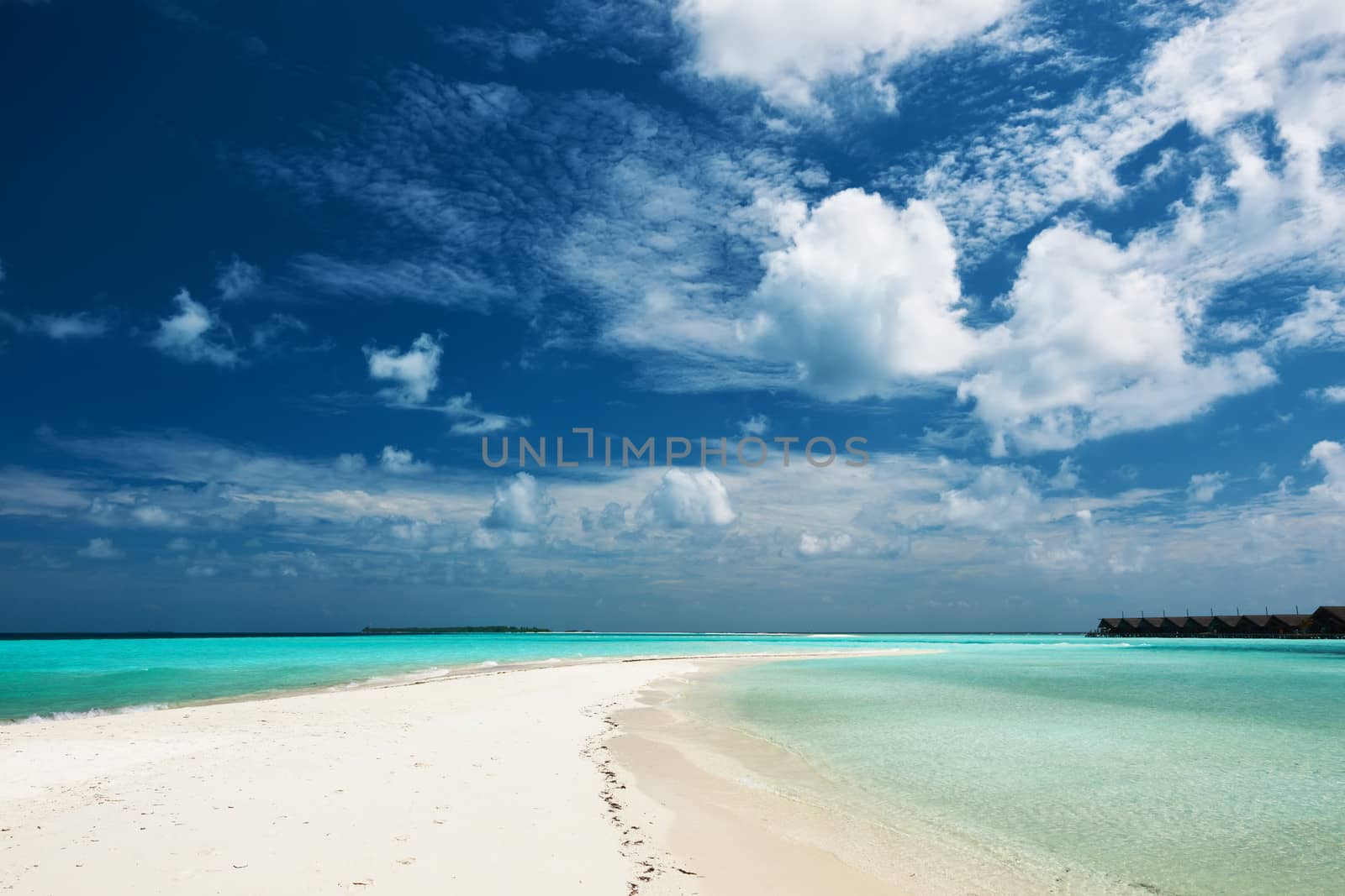 Beautiful island beach with sandspit at Maldives