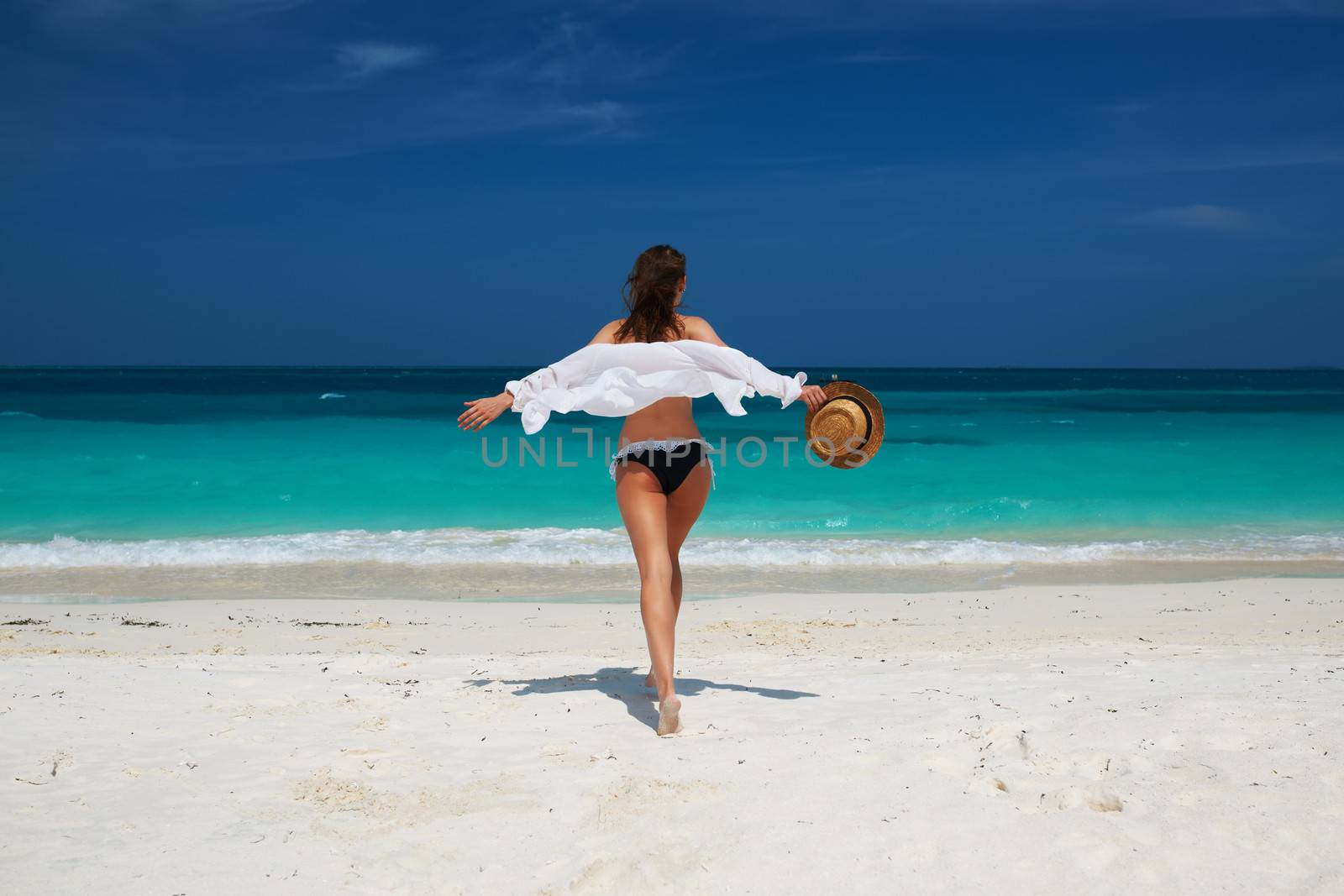 Woman in bikini at tropical beach