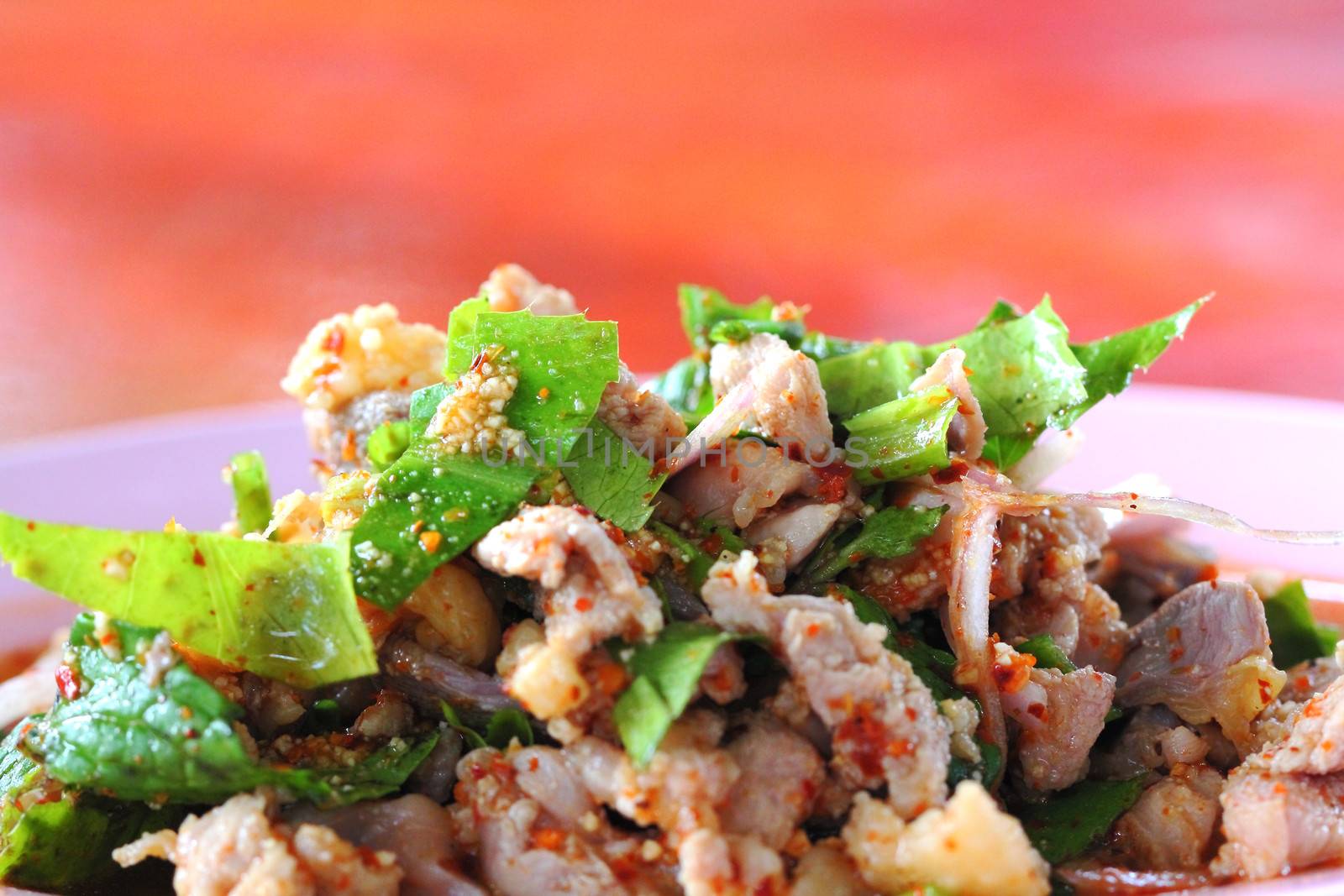 Spicy minced duck salad with green vegetables and chillies