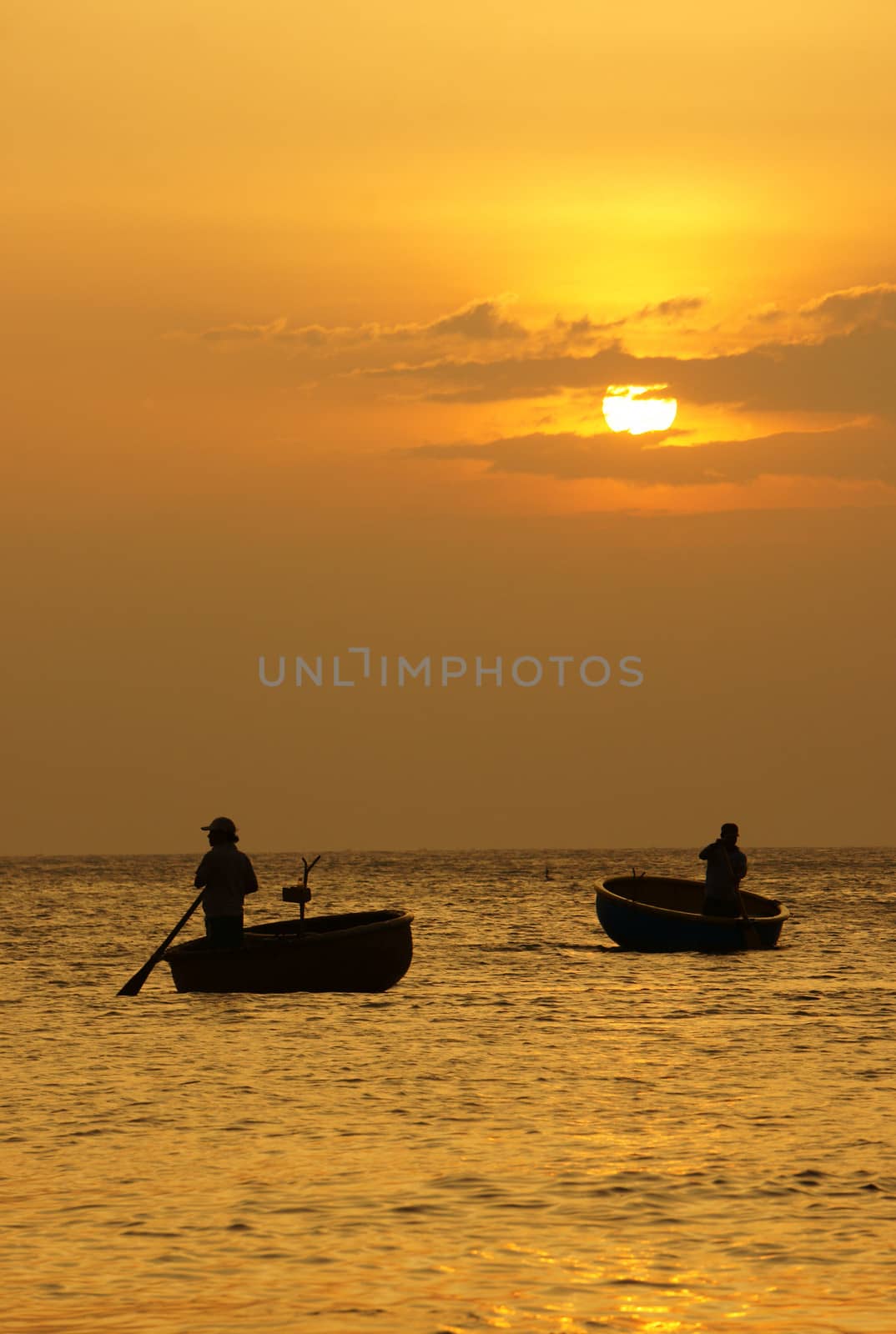 Beautiful landscape on ocean with silhouette of fisherman, sun a by xuanhuongho