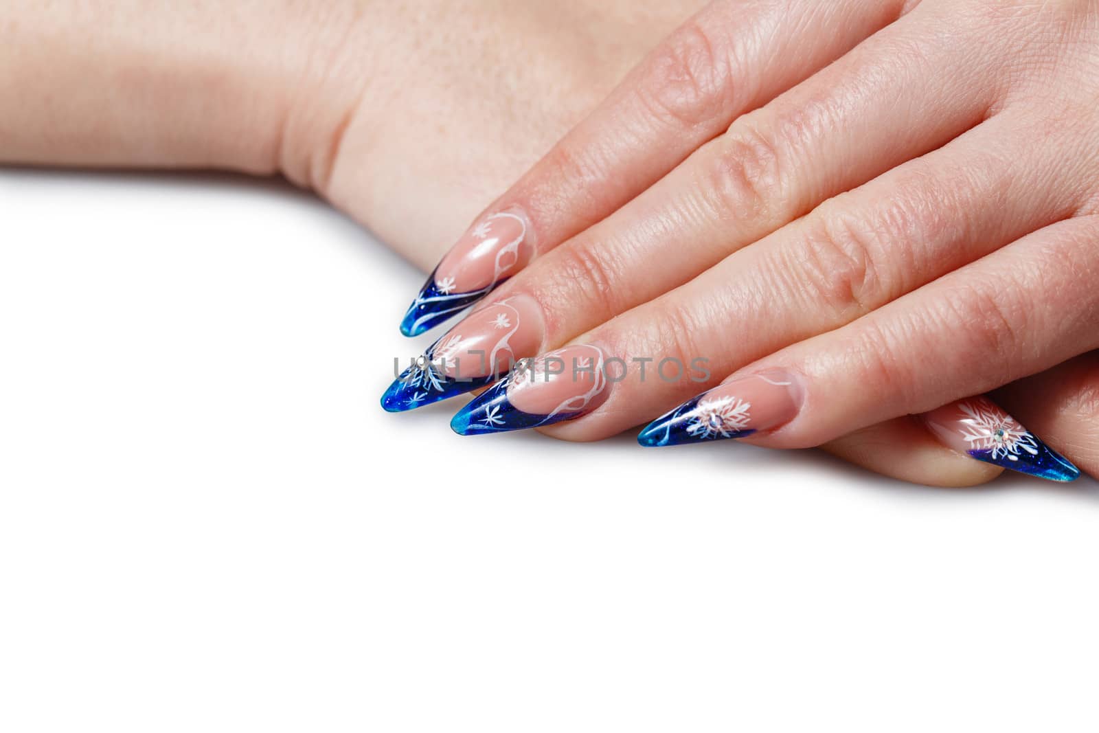 Beautiful manicure on female hand with long and thin fingers shot closeup
