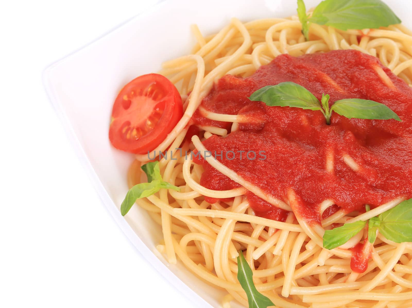 spaghetti with tomato sauce and basil. isolated on a white background